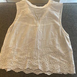 White cotton A-line top with flower cutouts